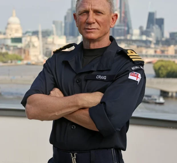 Daniel Craig proudly wears Royal Navy uniform after being made honorary Commander – the same rank held by James Bond